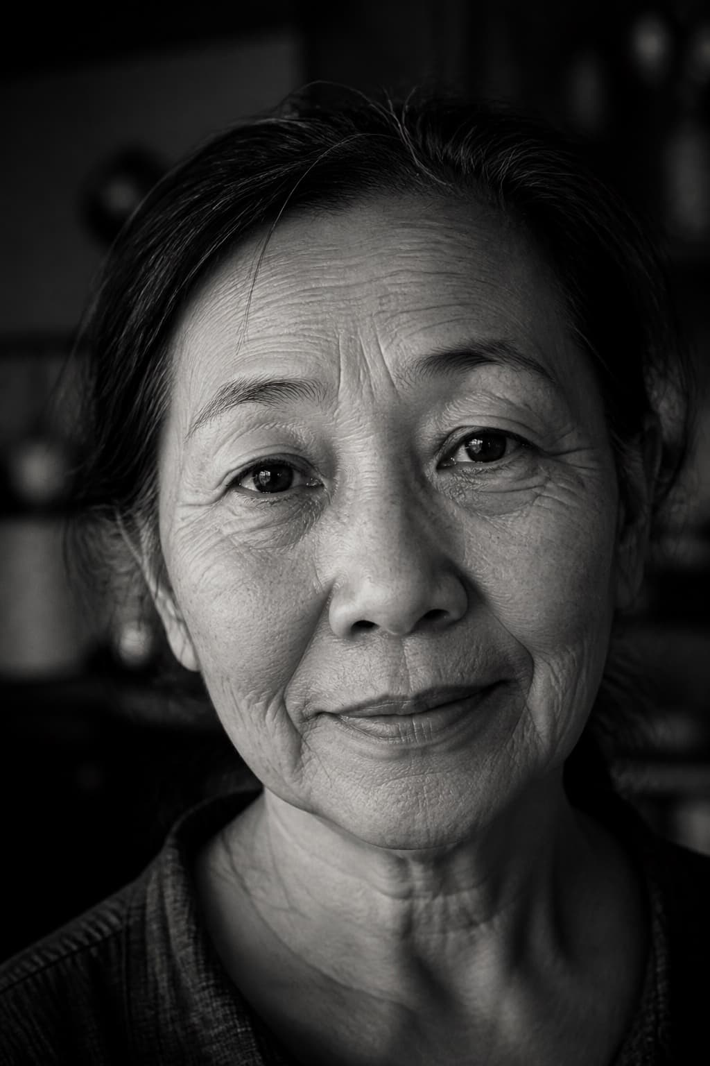 Black-and-white portrait of Lena looking directly at the camera